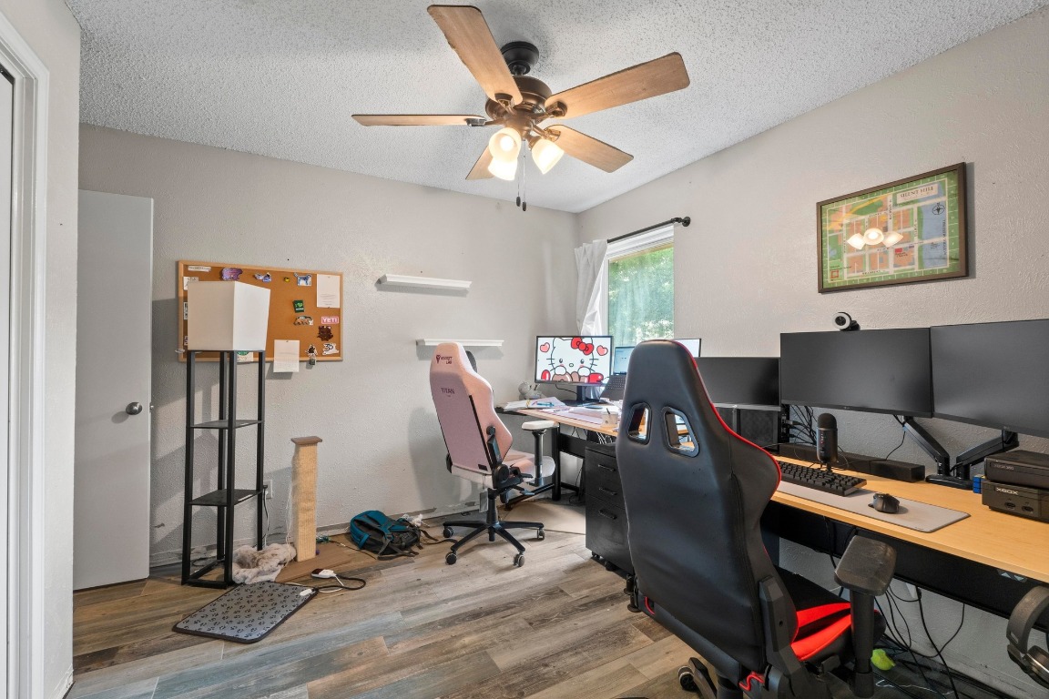 811 Timber Trail Cedar Park, TX 78613 - Photo 19 of 30 a view of a workspace with furniture and a window