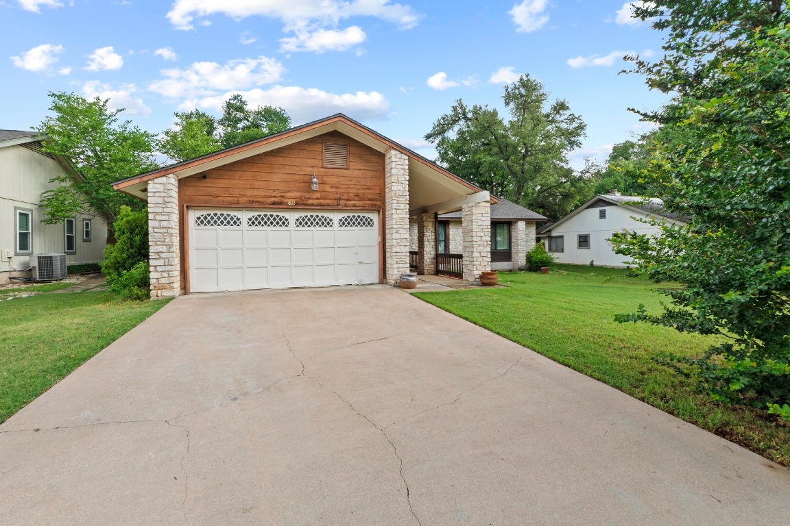 811 Timber Trail Cedar Park, TX 78613 - Photo 2 of 30 a front view of house with yard and green space