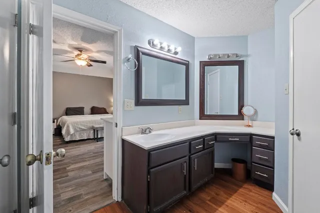 a spacious bedroom with a bed and a large window