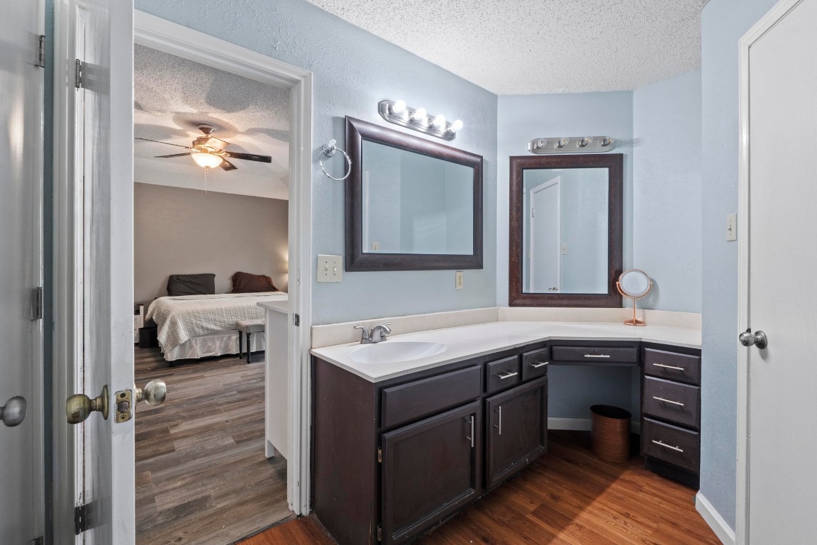 811 Timber Trail Cedar Park, TX 78613 - Photo 24 of 30 a en suite bathroom with a double vanity sink and a mirror