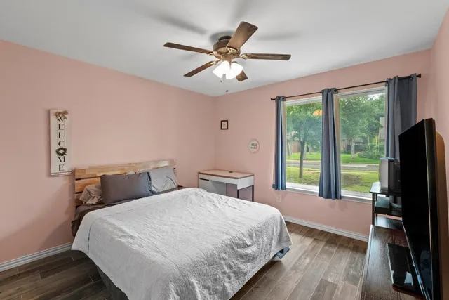 a bathroom with a sink a toilet and shower curtain