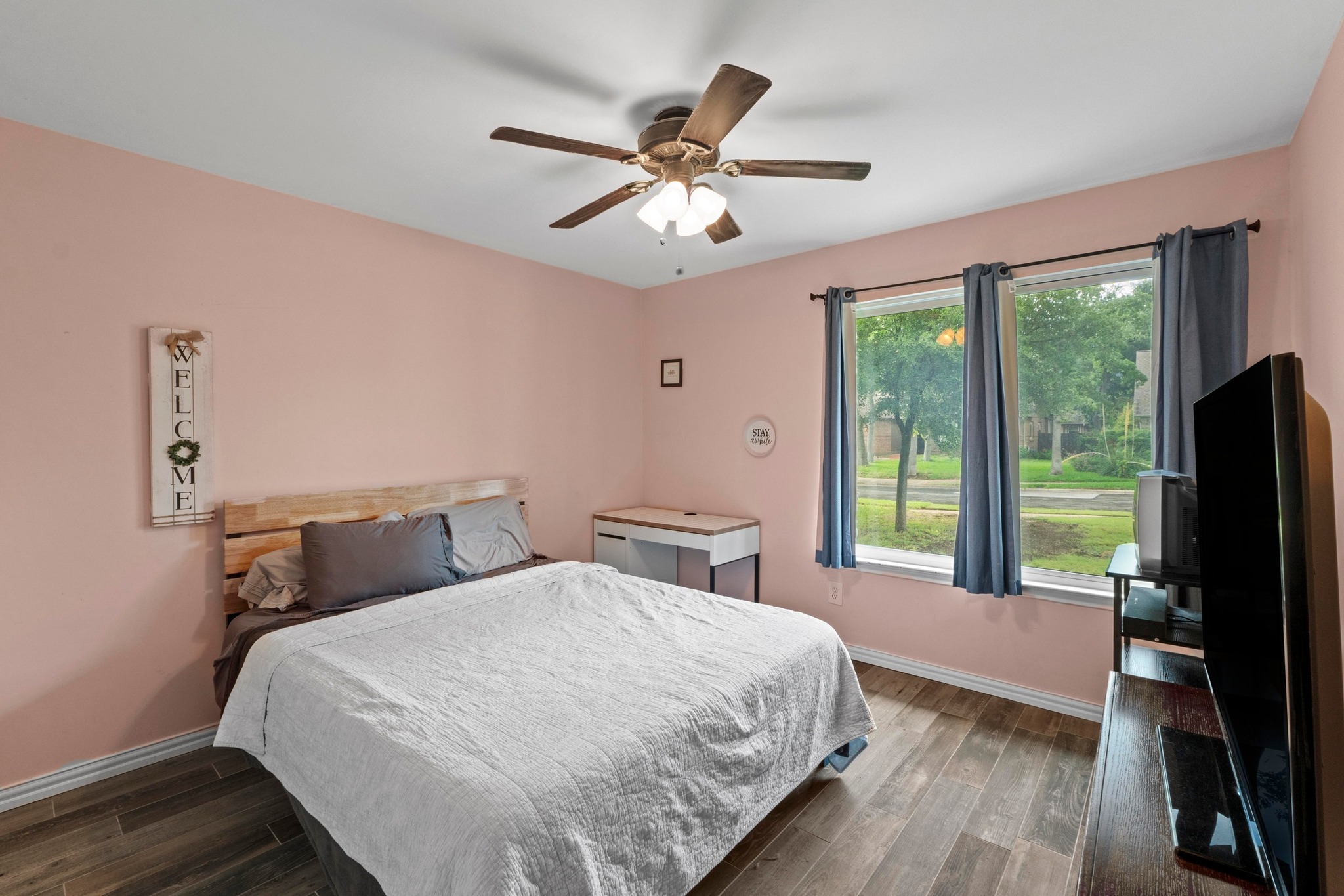 811 Timber Trail Cedar Park, TX 78613 - Photo 25 of 30 a bedroom with a large bed and a large window