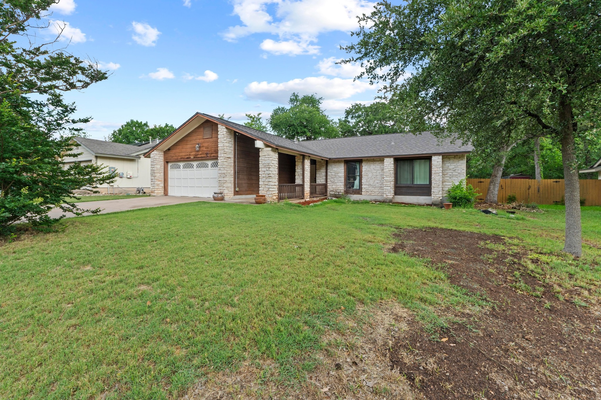 811 Timber Trail Cedar Park, TX 78613 - Photo 3 of 30 a front view of a house with a garden