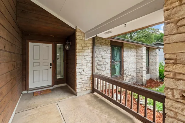 a view of a porch with wooden floor and outdoor space