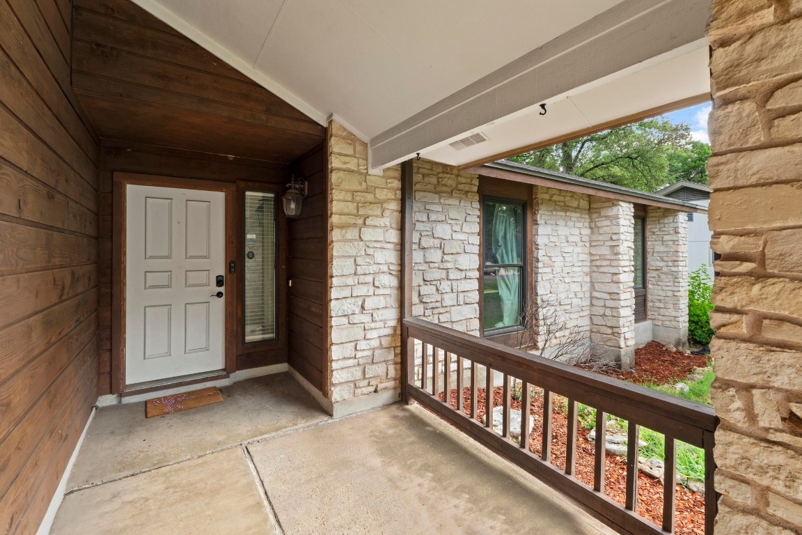 811 Timber Trail Cedar Park, TX 78613 - Photo 4 of 30 a view of a porch with wooden floor and outdoor space