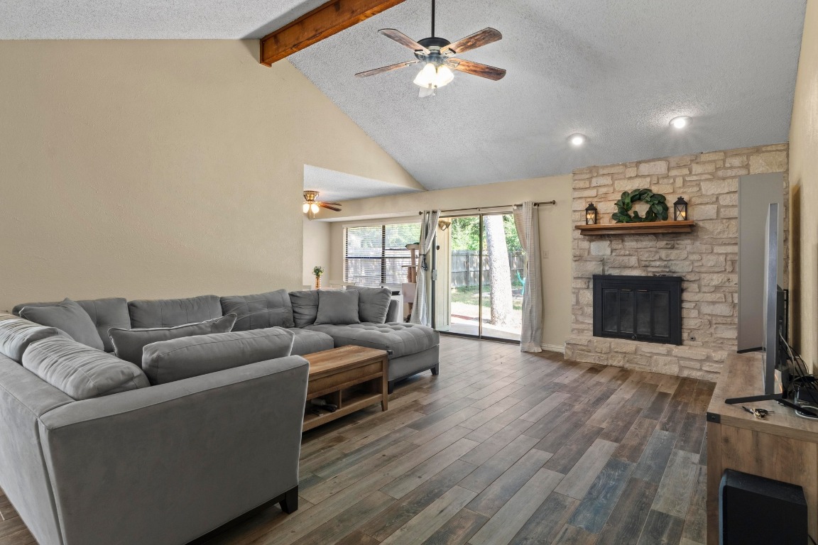 811 Timber Trail Cedar Park, TX 78613 - Photo 5 of 30 a living room with furniture and a fireplace