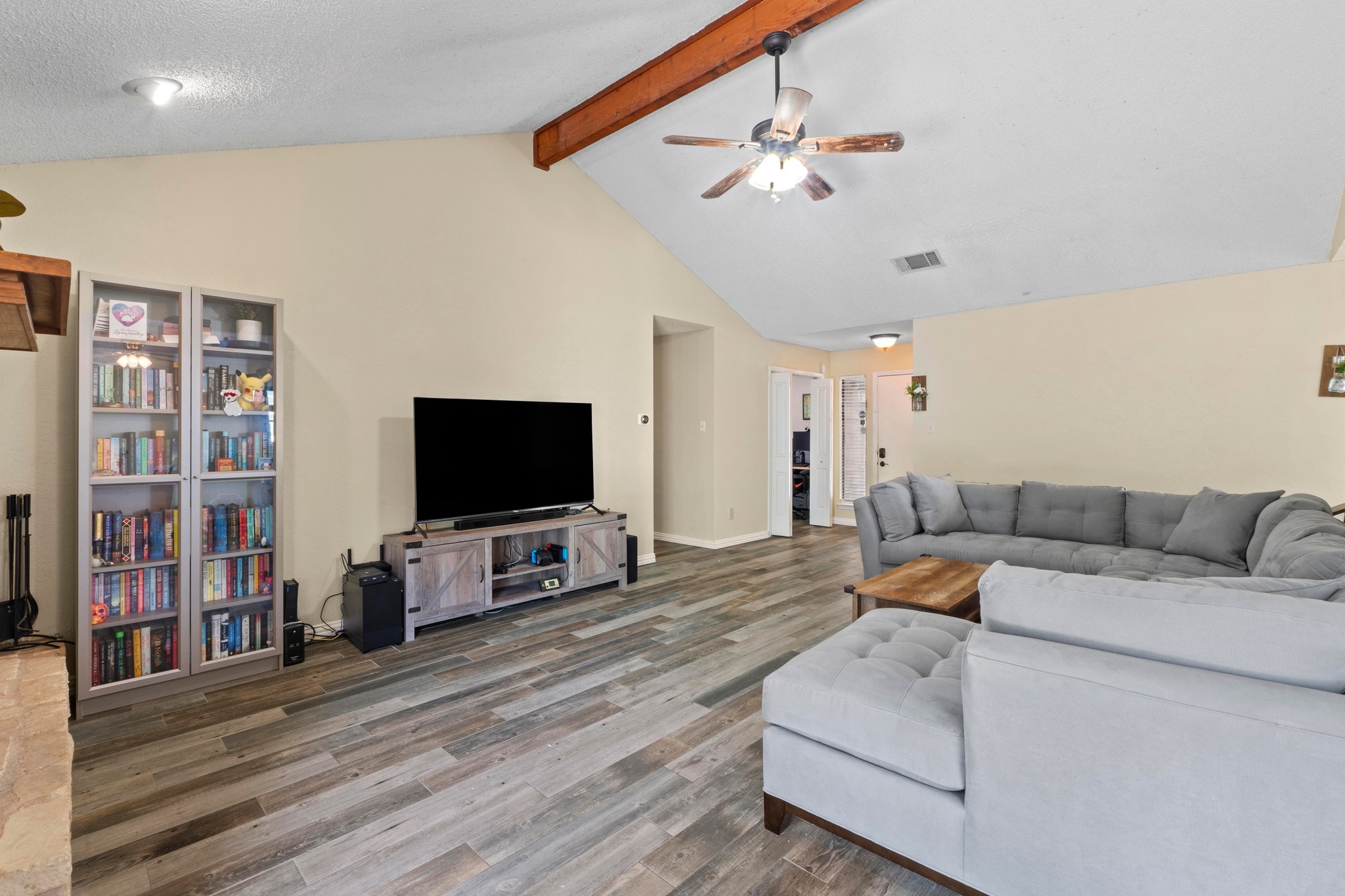 811 Timber Trail Cedar Park, TX 78613 - Photo 9 of 30 a living room with furniture and a flat screen tv
