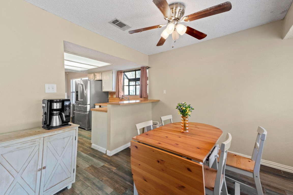 811 Timber Trail Cedar Park, TX 78613 - Photo 10 of 30 a dining room with furniture and chandelier