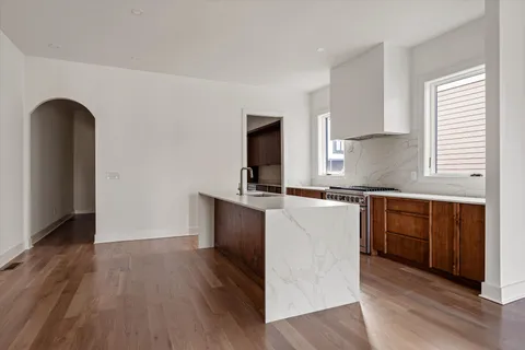 a kitchen with a sink and a large window