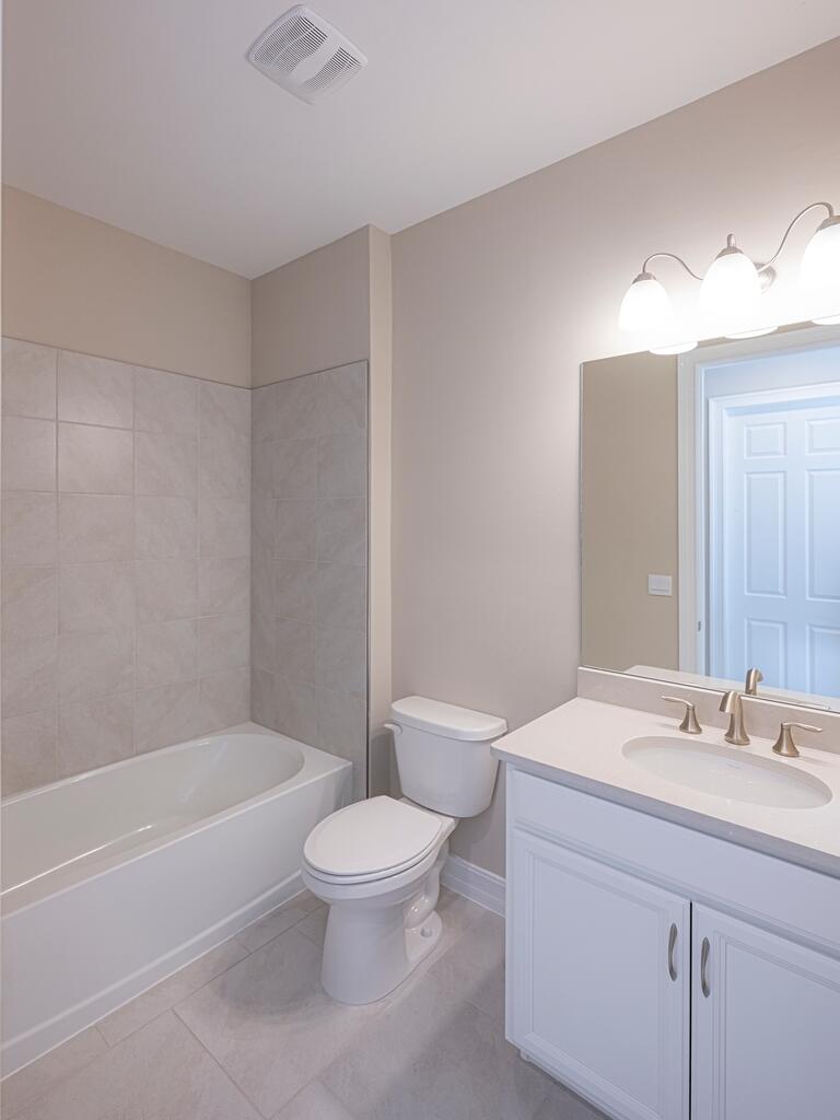 1087 Rolling Brk Lane Naples, FL 34114 - Photo 11 of 33 a bathroom with a sink a toilet and shower