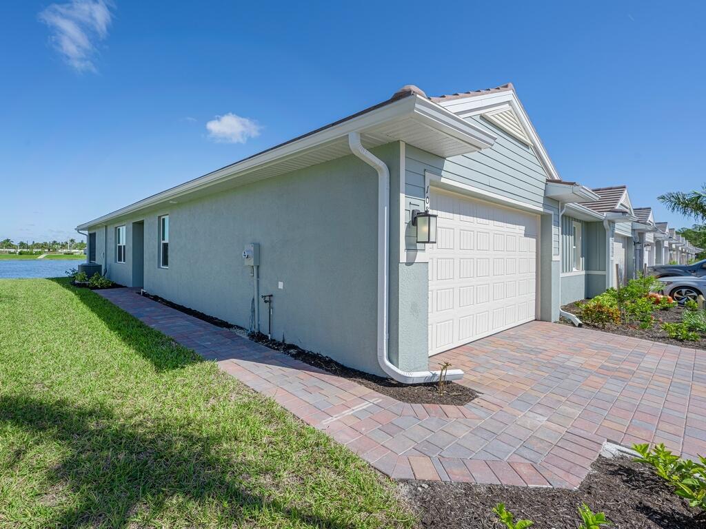1087 Rolling Brk Lane Naples, FL 34114 - Photo 16 of 33 a house view with a backyard space