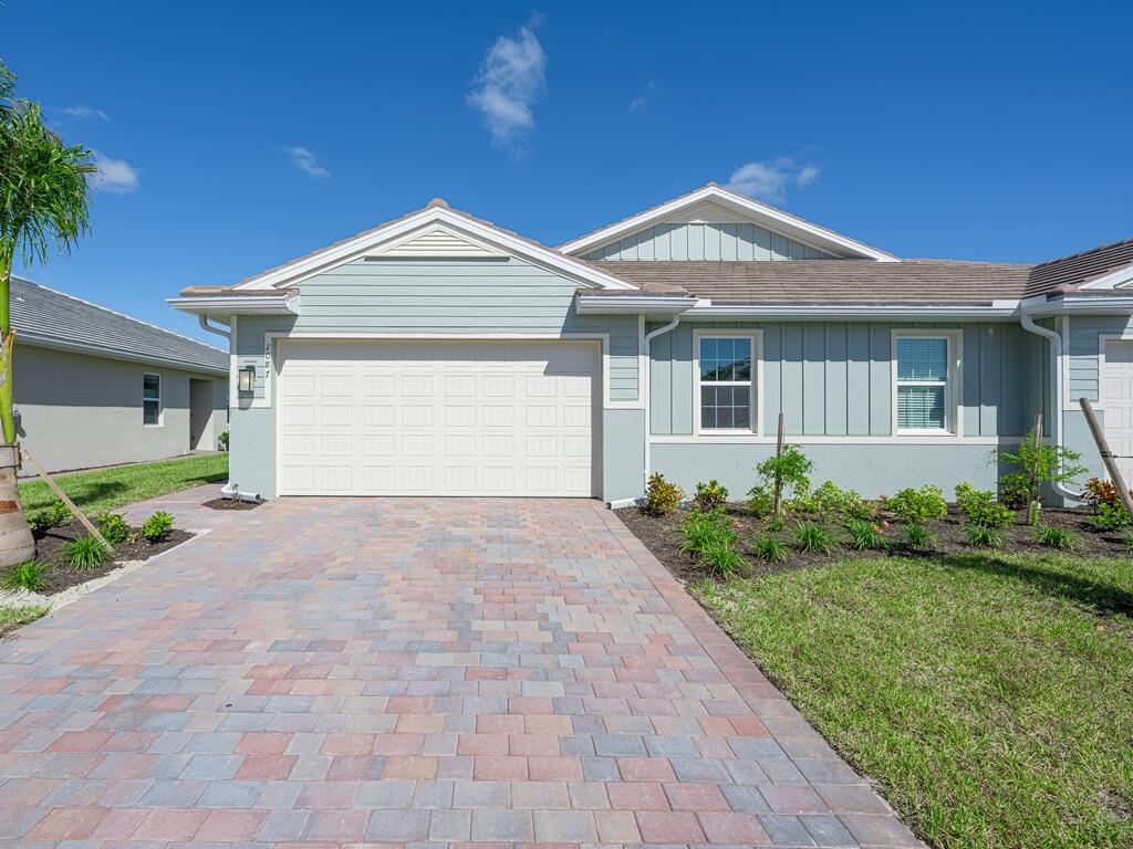 1087 Rolling Brk Lane Naples, FL 34114 - Photo 18 of 33 a view of a house with a yard and potted plants