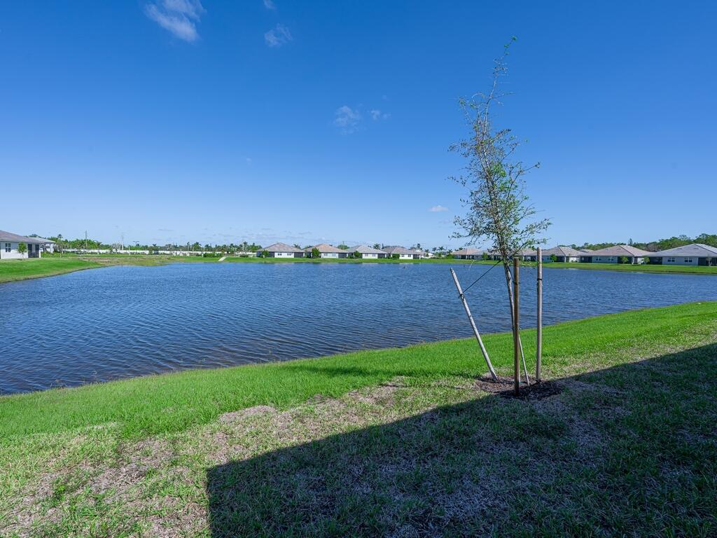 1087 Rolling Brk Lane Naples, FL 34114 - Photo 19 of 33 a view of a garden with a lake view