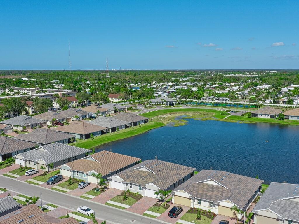 1087 Rolling Brk Lane Naples, FL 34114 - Photo 20 of 33 an aerial view of a city and lake view