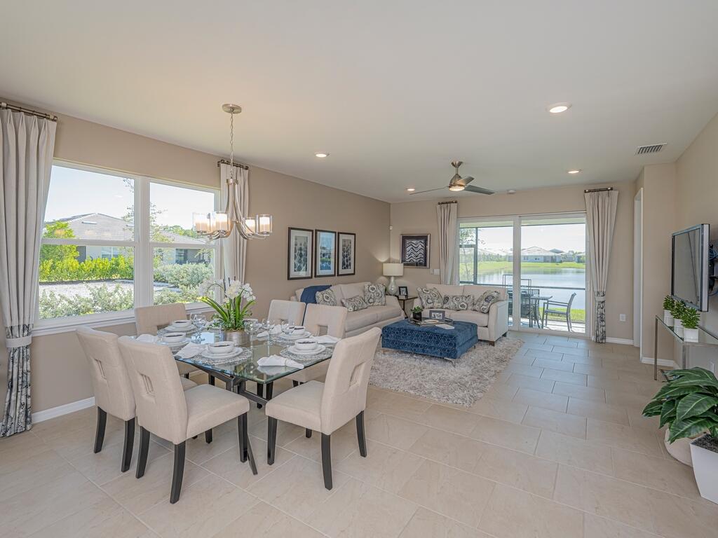 1087 Rolling Brk Lane Naples, FL 34114 - Photo 2 of 33 a view of a dining room with furniture window and outside view