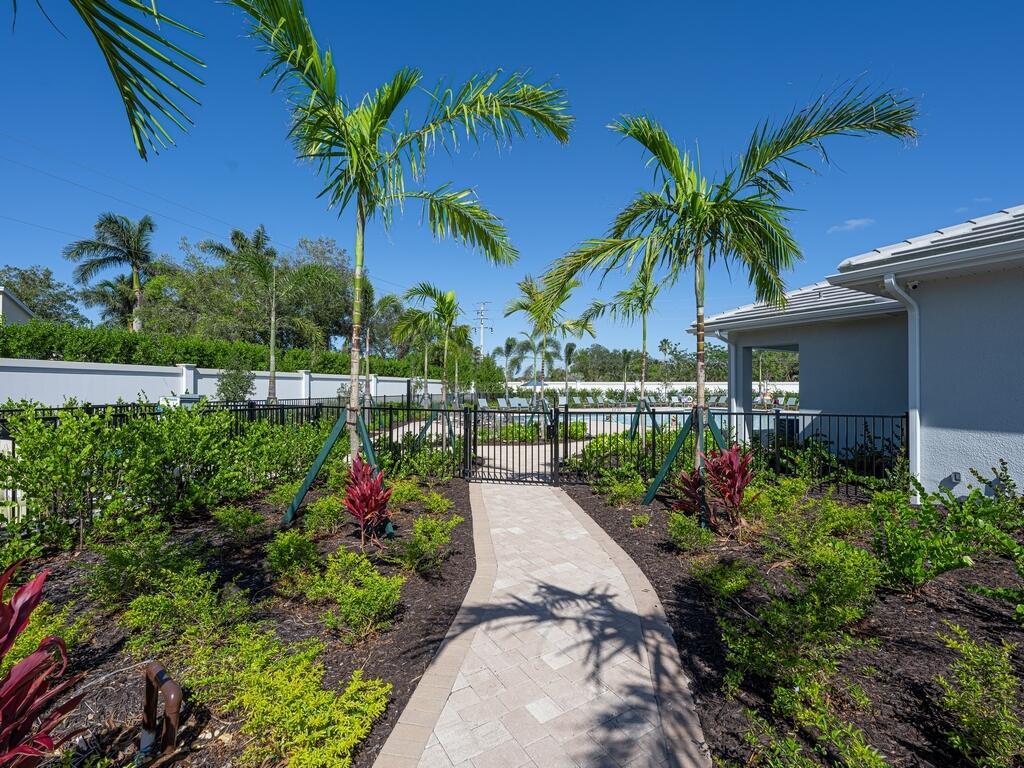 1087 Rolling Brk Lane Naples, FL 34114 - Photo 24 of 33 a view of a garden with a fountain