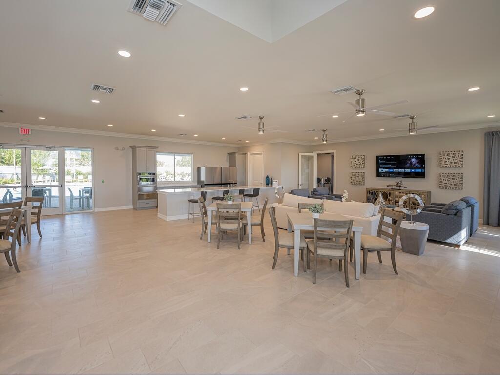 1087 Rolling Brk Lane Naples, FL 34114 - Photo 28 of 33 a large kitchen with a table and chairs