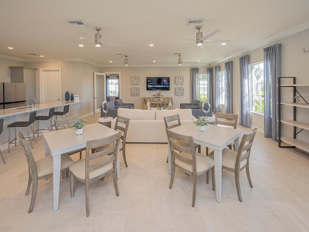 1087 Rolling Brk Lane Naples, FL 34114 - Photo 29 of 33 a view of a dining room with furniture