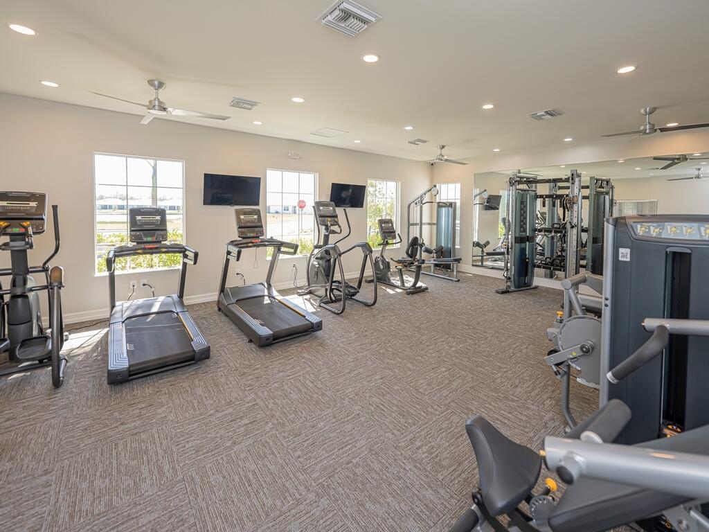 1087 Rolling Brk Lane Naples, FL 34114 - Photo 30 of 33 a view of a room with gym equipment