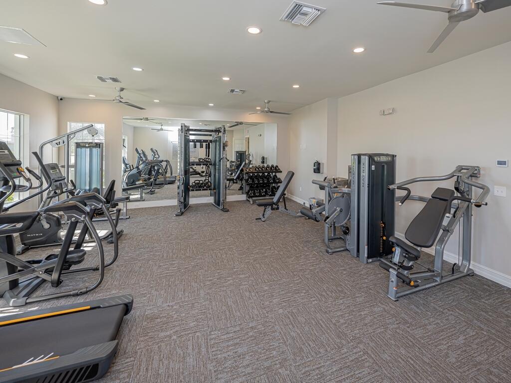 1087 Rolling Brk Lane Naples, FL 34114 - Photo 31 of 33 a view of a room with gym equipment