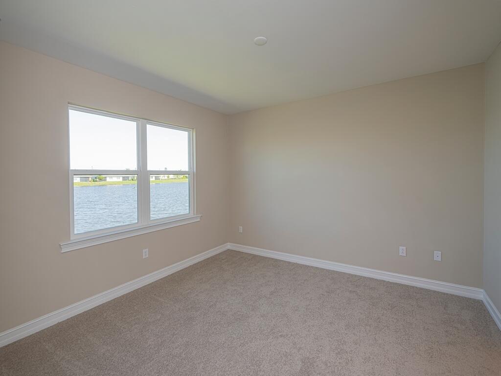 1087 Rolling Brk Lane Naples, FL 34114 - Photo 6 of 33 an empty room with a window