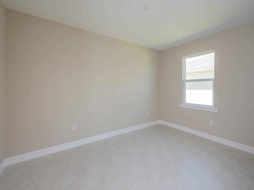 1087 Rolling Brk Lane Naples, FL 34114 - Photo 9 of 33 an empty room with a window
