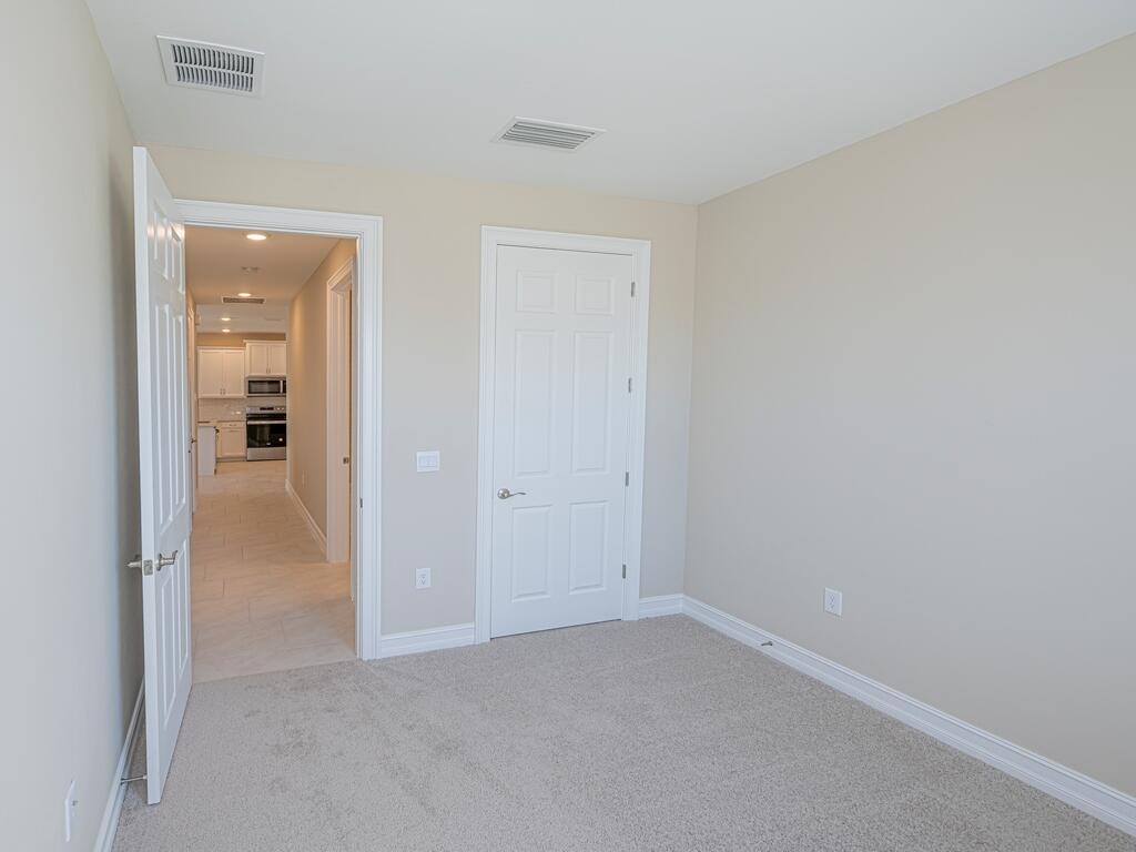 1087 Rolling Brk Lane Naples, FL 34114 - Photo 10 of 33 an empty room with closet