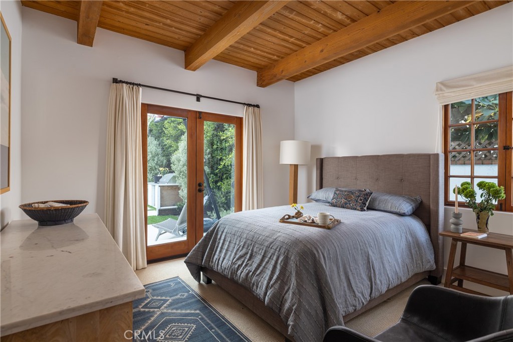 419 Signal Road Newport Beach, CA 92663 - Photo 14 of 32 a bedroom with a bed and a large window