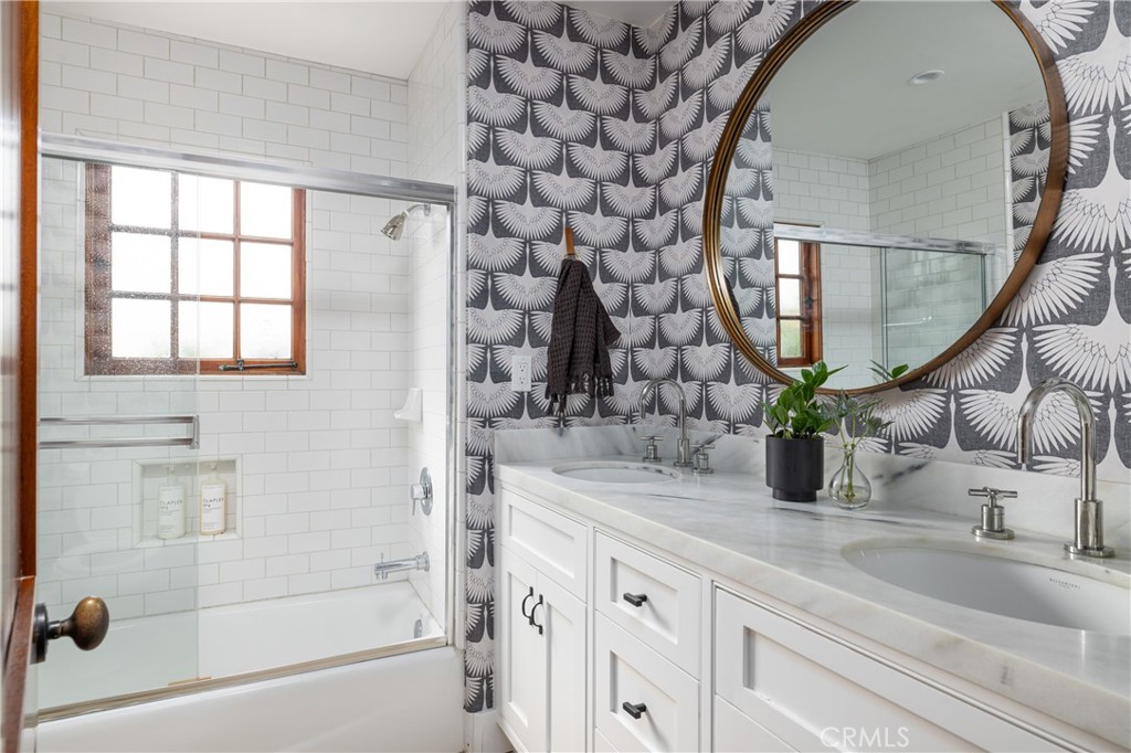 419 Signal Road Newport Beach, CA 92663 - Photo 18 of 32 a bathroom with a sink and a mirror