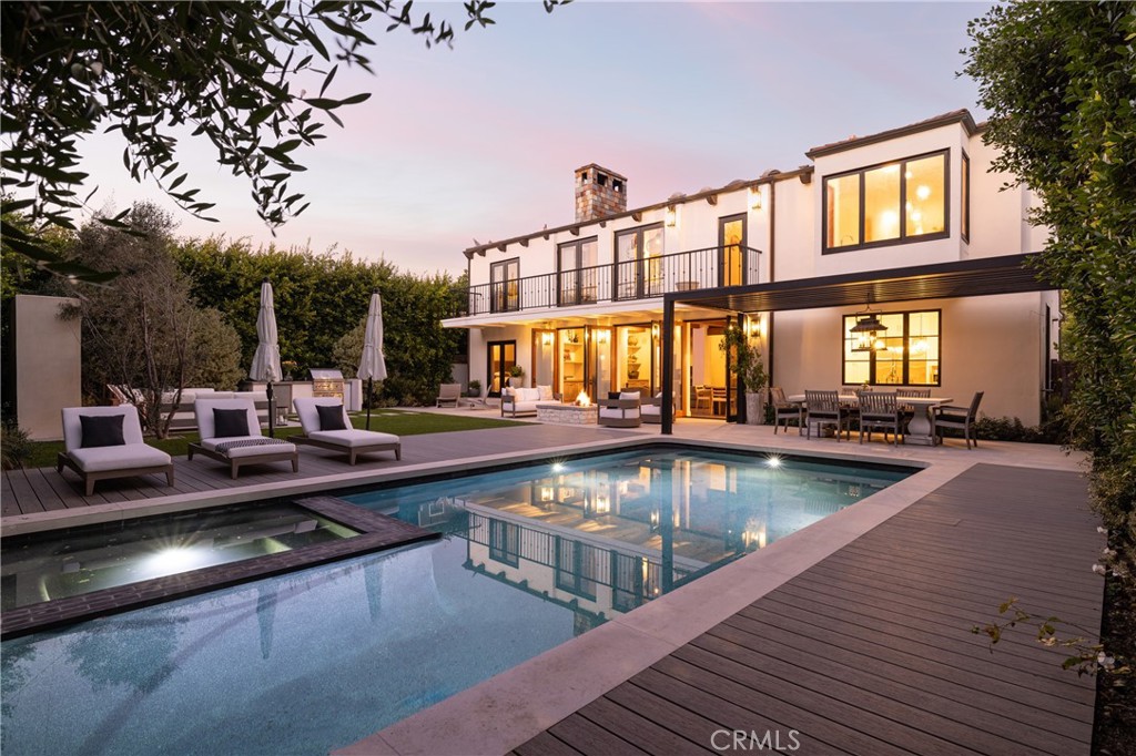 419 Signal Road Newport Beach, CA 92663 - Photo 2 of 32 a view of a swimming pool with outdoor seating