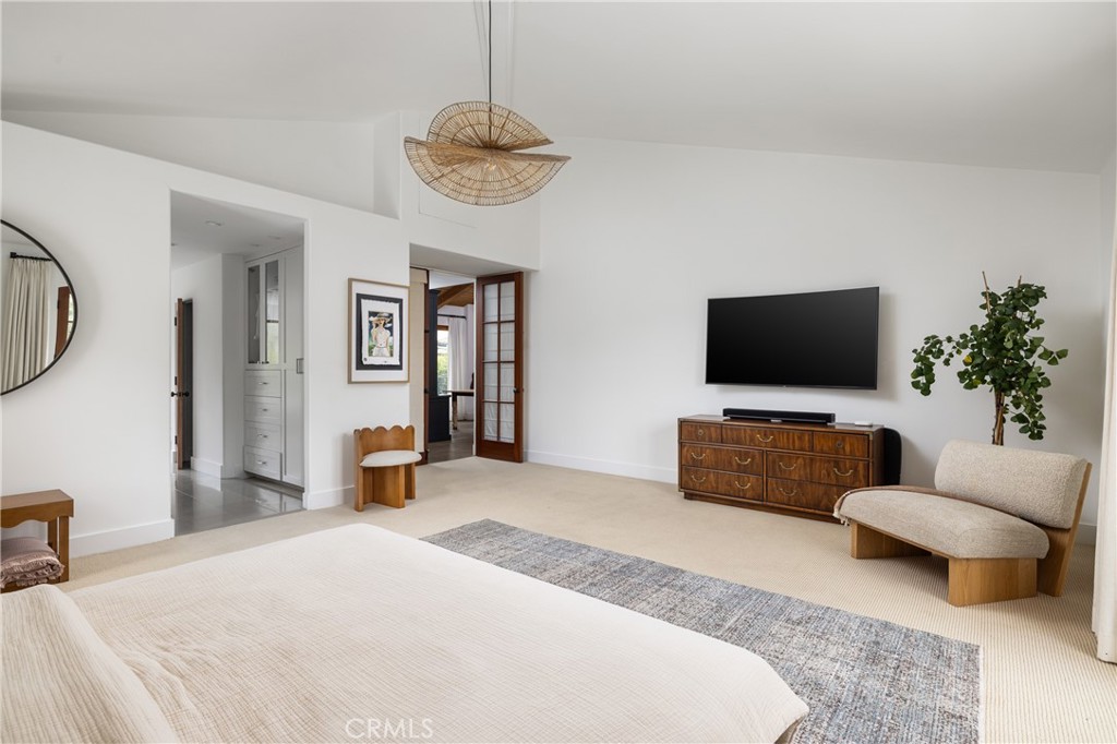 419 Signal Road Newport Beach, CA 92663 - Photo 21 of 32 a bedroom with furniture and a flat screen tv