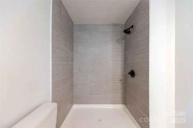 a bathroom with a tub and shower