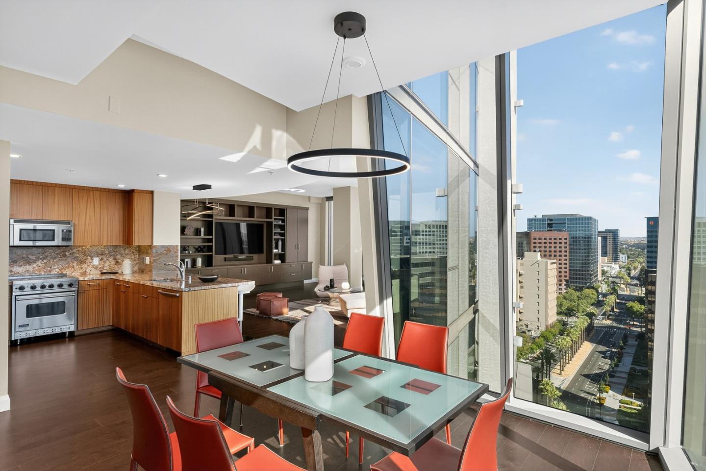 38 North Almaden Boulevard, Unit 2001 San Jose, CA 95110 - Photo 22 of 44 a large kitchen with a table and chairs in it