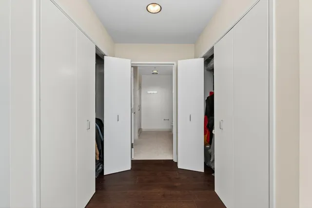 a en suite bathroom with a granite countertop sink and a mirror