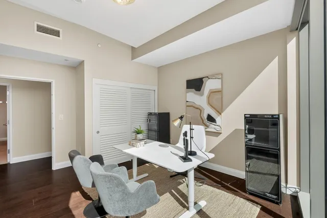 a bathroom with a double vanity sink toilet and a mirror