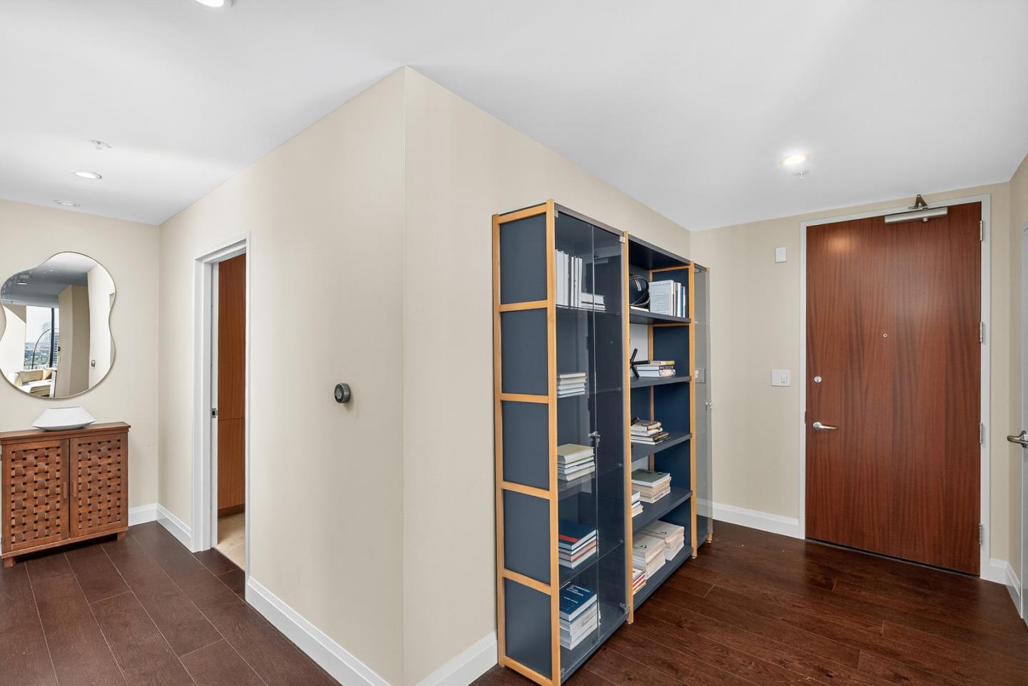 38 North Almaden Boulevard, Unit 2001 San Jose, CA 95110 - Photo 41 of 44 a view of an empty room with wooden floor and closet