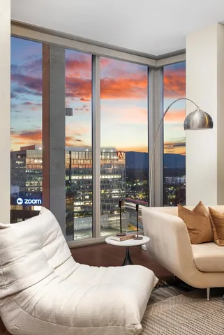 a large kitchen with stainless steel appliances a large window and a counter space