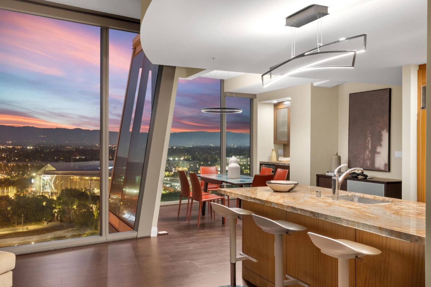 38 North Almaden Boulevard, Unit 2001 San Jose, CA 95110 - Photo 6 of 44 a large kitchen with stainless steel appliances a large window and a counter space