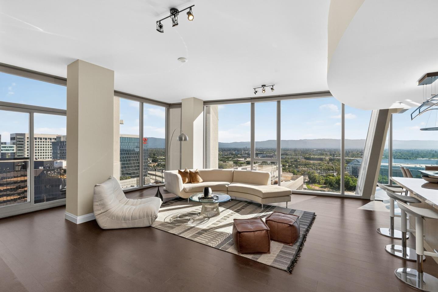 38 North Almaden Boulevard, Unit 2001 San Jose, CA 95110 - Photo 10 of 44 a living room with furniture and floor to ceiling windows