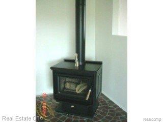 2225 7 Mile Road South Lyon, MI 48178 - Photo 12 of 17 7 mile wood stove