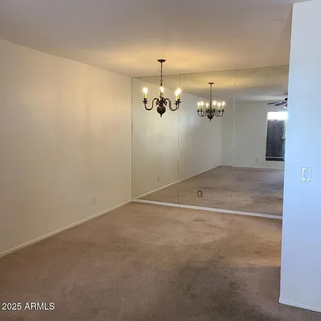 an empty room with a mirror