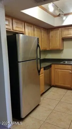 a white refrigerator freezer sitting in a kitchen