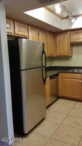 a white refrigerator freezer sitting in a kitchen