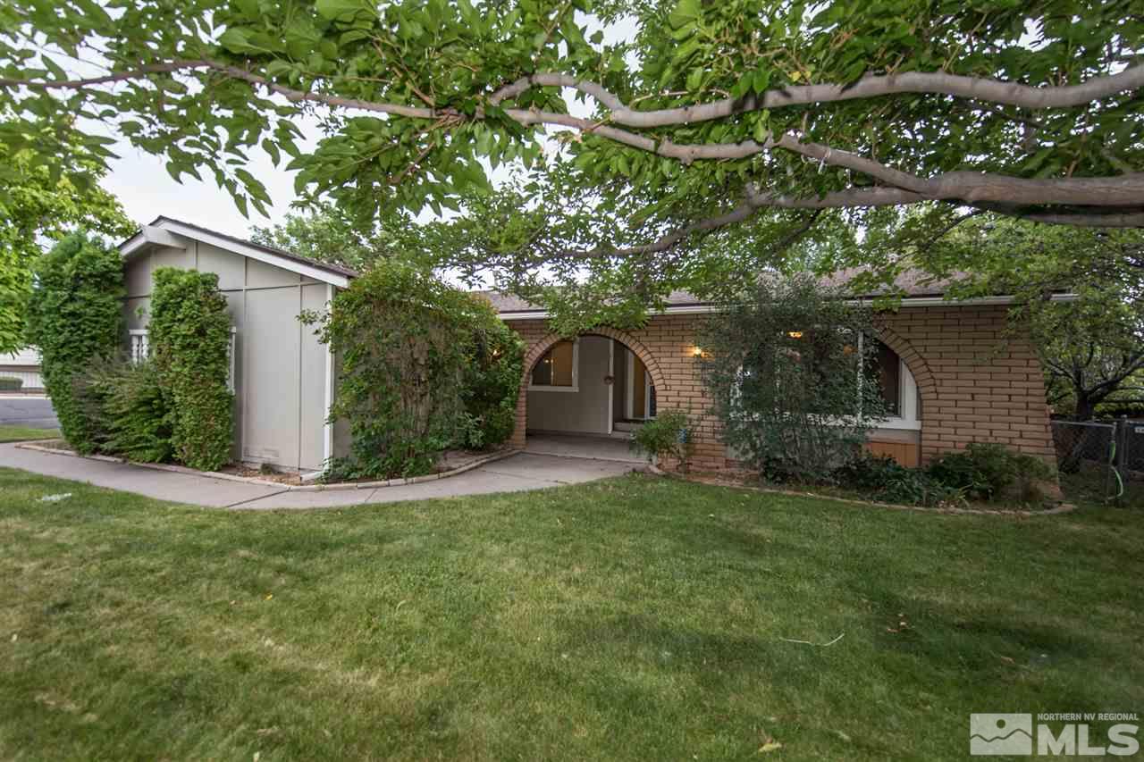 3375 Lookout Place Reno, NV 89503 - Photo 1 of 25 a front view of a house with a garden