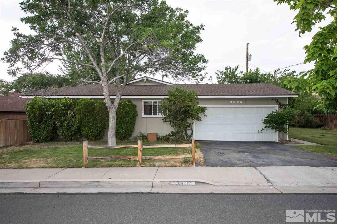 3375 Lookout Place Reno, NV 89503 - Photo 20 of 25 a view of a house with a yard and large tree