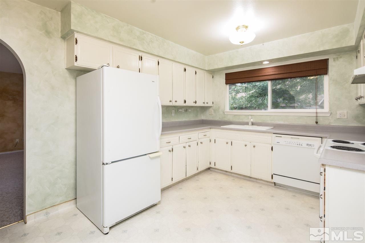 3375 Lookout Place Reno, NV 89503 - Photo 5 of 25 a white refrigerator freezer sitting inside of a kitchen