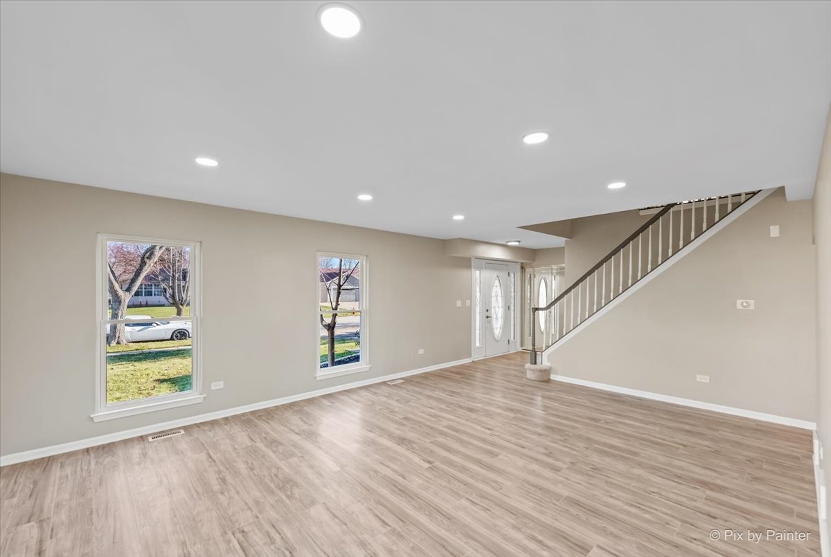 2004 Clematis Drive Algonquin, IL 60102 - Photo 17 of 44 a view of empty room with wooden floor and window