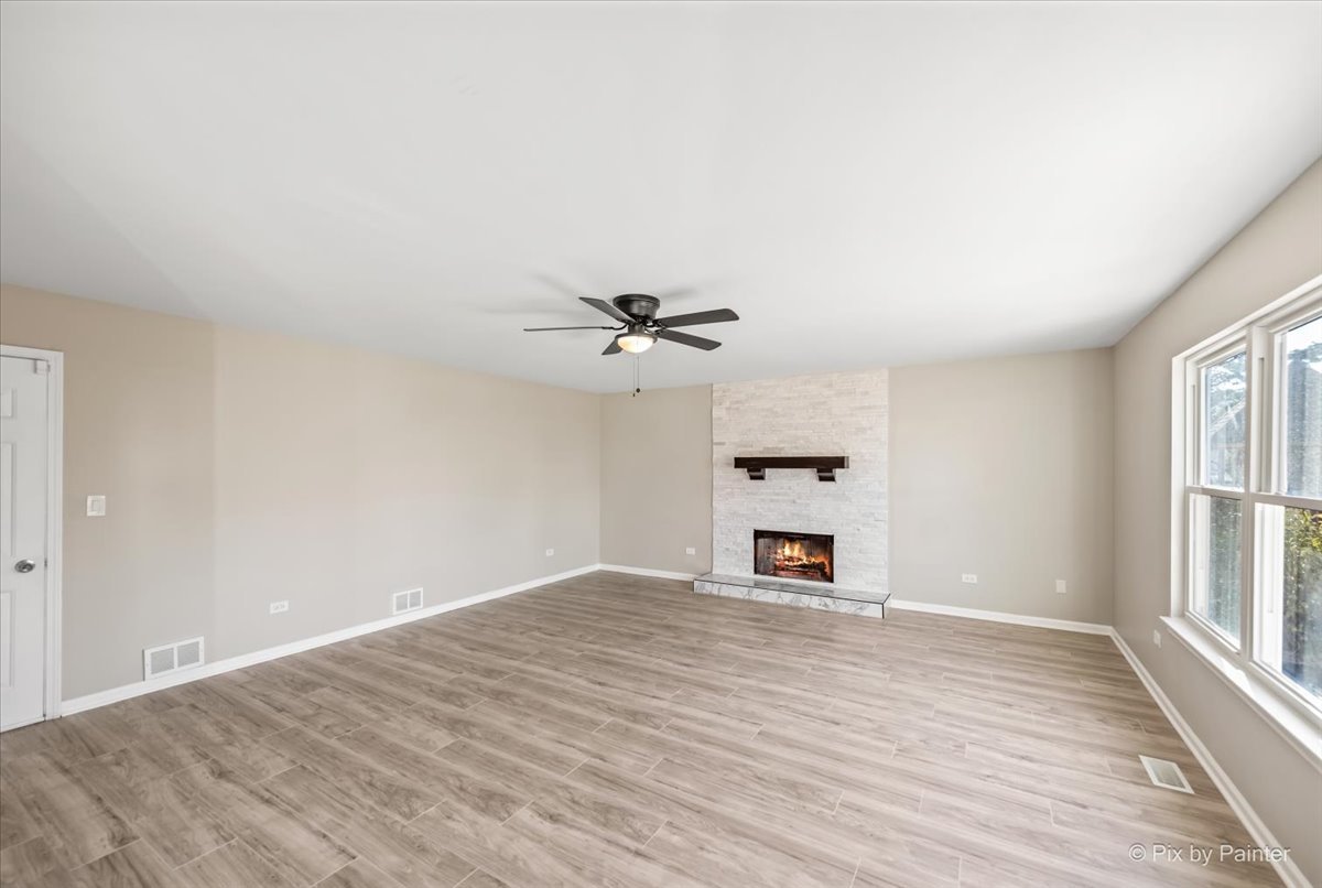 2004 Clematis Drive Algonquin, IL 60102 - Photo 21 of 44 wooden floor in an empty room with a window