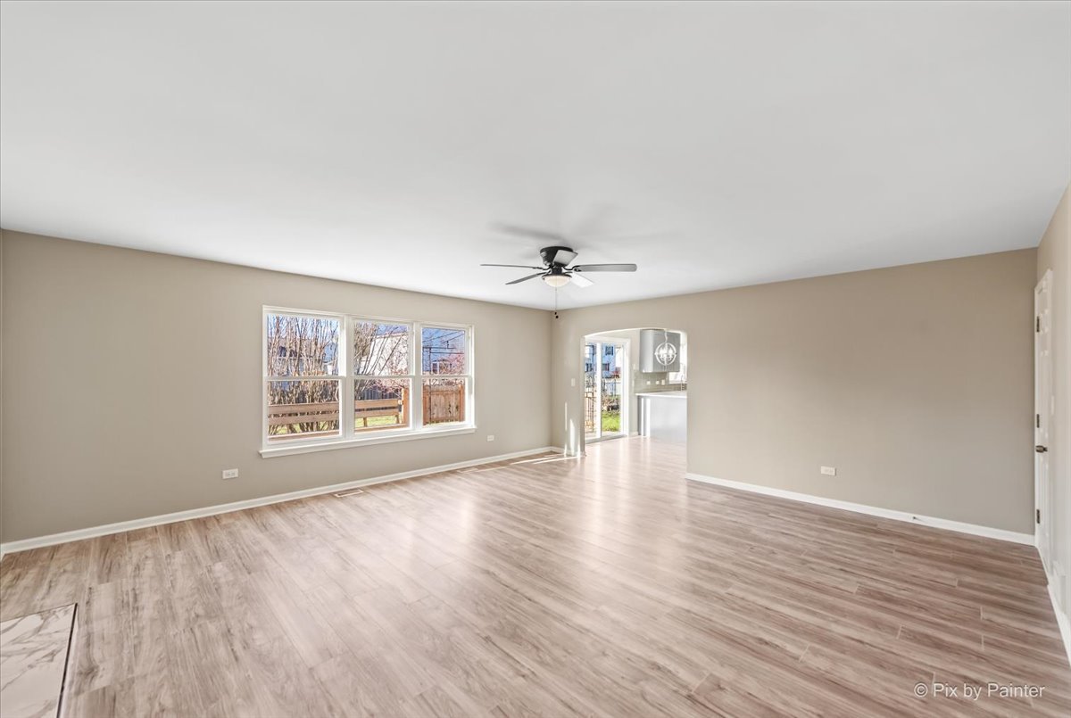 2004 Clematis Drive Algonquin, IL 60102 - Photo 22 of 44 an empty room with wooden floor and windows