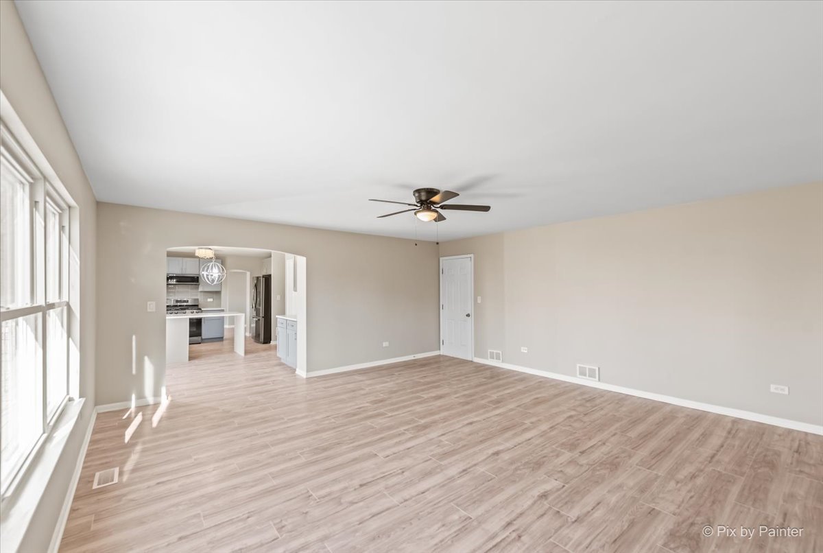 2004 Clematis Drive Algonquin, IL 60102 - Photo 23 of 44 wooden floor in an empty room with a window
